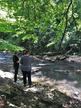 A picture of two volunteers conducting a visual habitat survey.